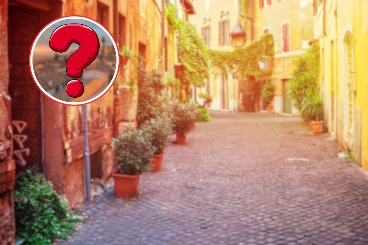 borgo sullo sfondo, castel san pietro sfocato e punto interrogativo