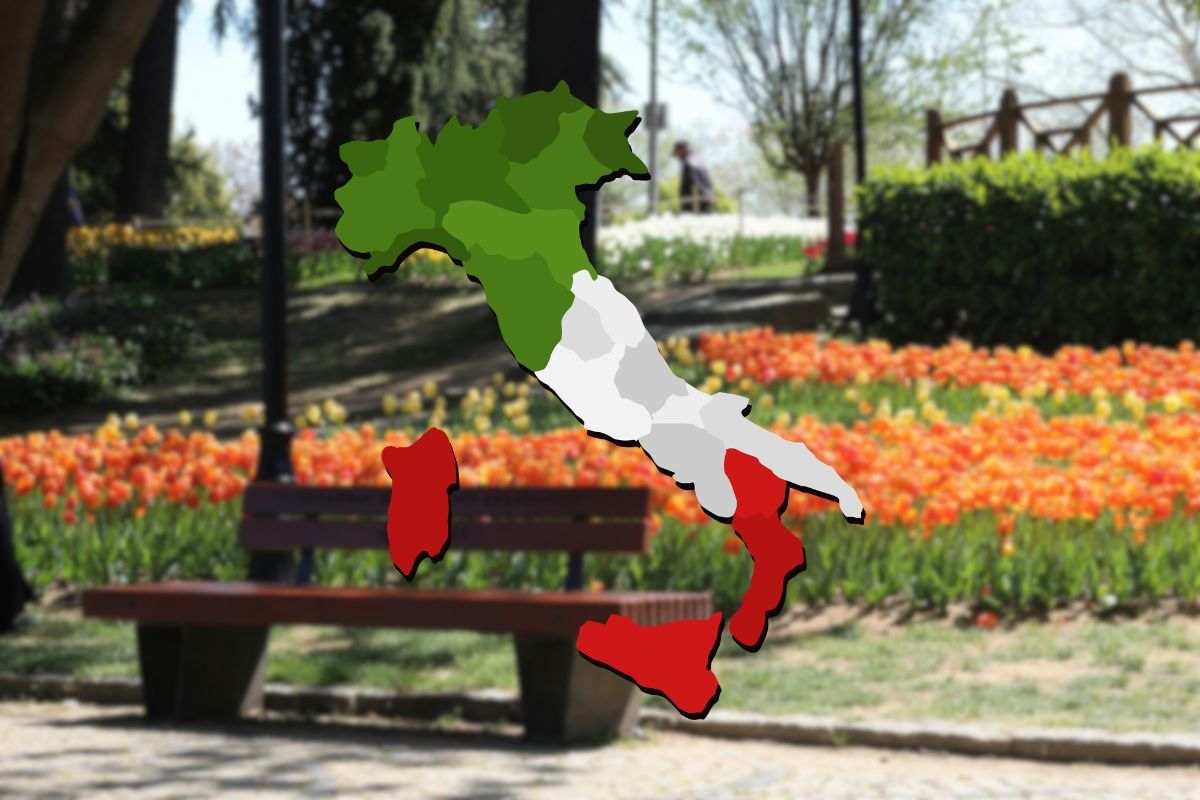 giardino con tulipani come sfondo e cartina dell'italia in primo piano